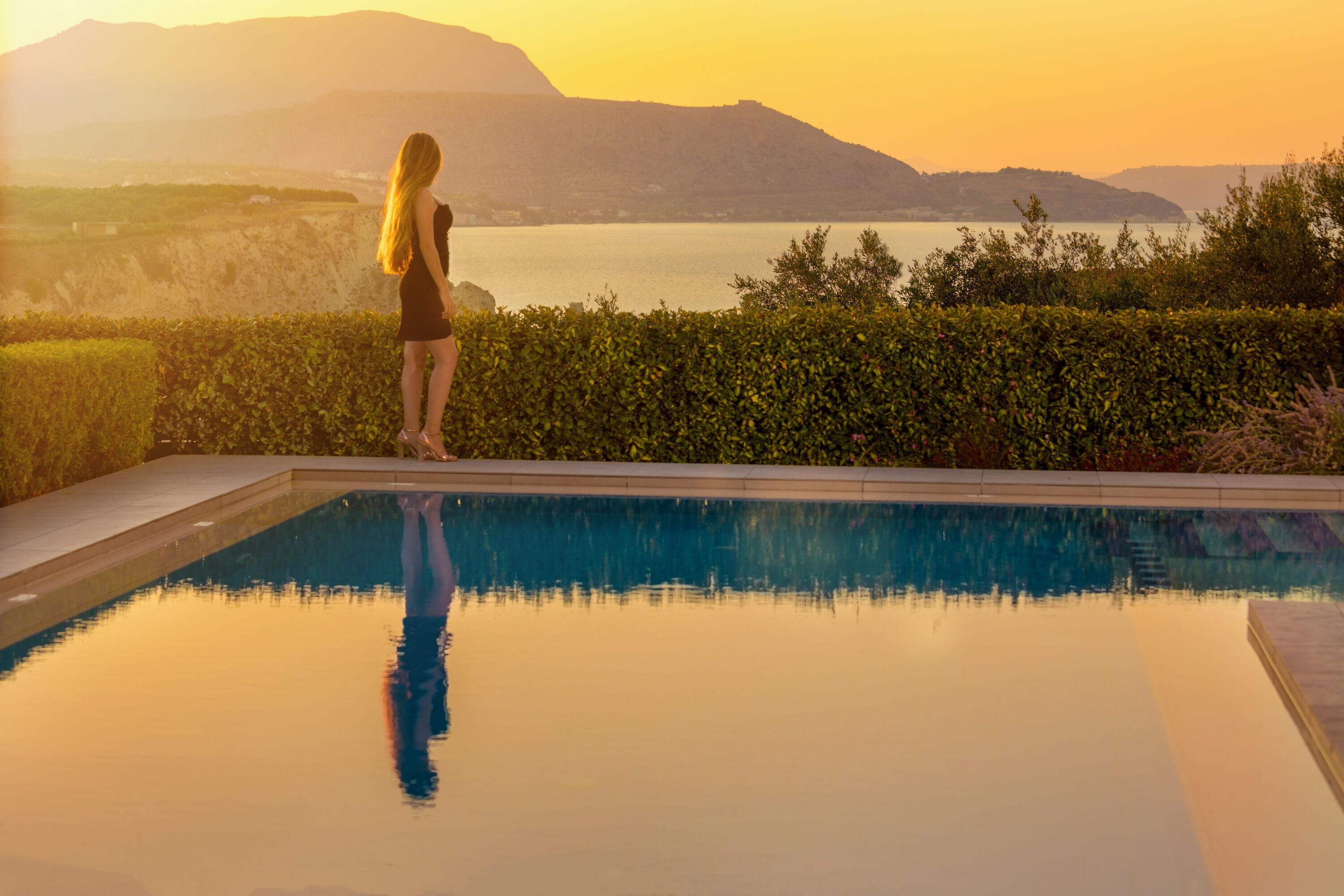 A heated pool, pool loungers