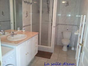 Shower, hair dryer, soap, toilet paper