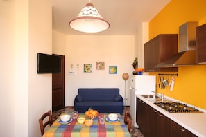 Fridge, microwave, coffee/tea maker, cookware/dishes/utensils