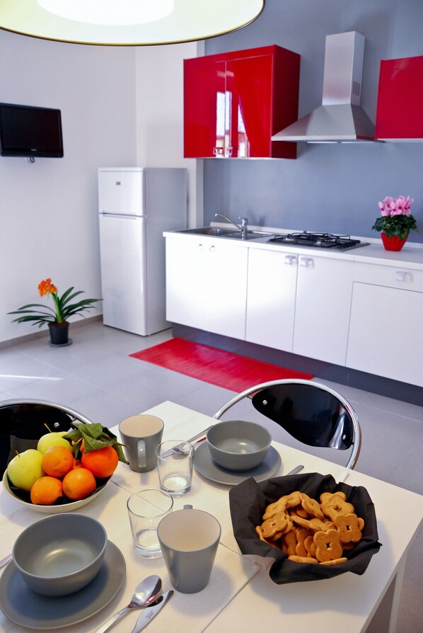 Fridge, microwave, cookware/dishes/utensils
