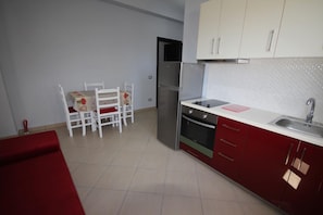 Apartment, Sea View | Private kitchen | Full-sized fridge, oven, stovetop, electric kettle