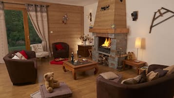 Télévision, cheminée, lecteur de DVD, baby-foot