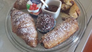 A plate with pastries and a cup of coffee. - La Tavernetta Apartment CIN IT077014C201874001 (MATERA)