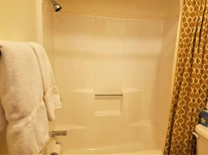 Bathtub, hair dryer, towels