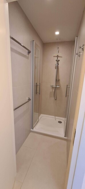 Combined shower/tub, hair dryer, towels, toilet paper