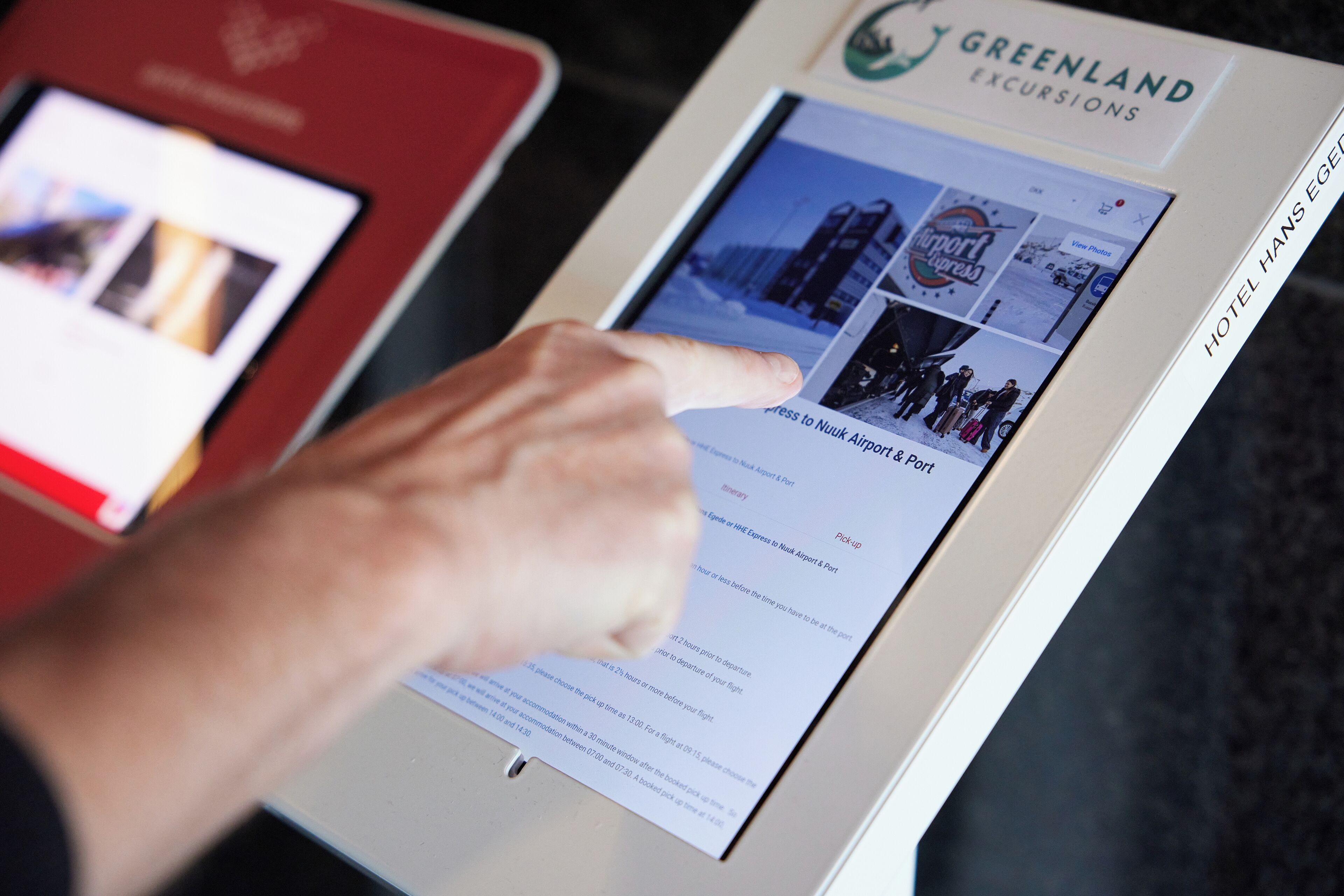 A digital display of a travel website with a focus on a booking page for Greenland Excursions.
