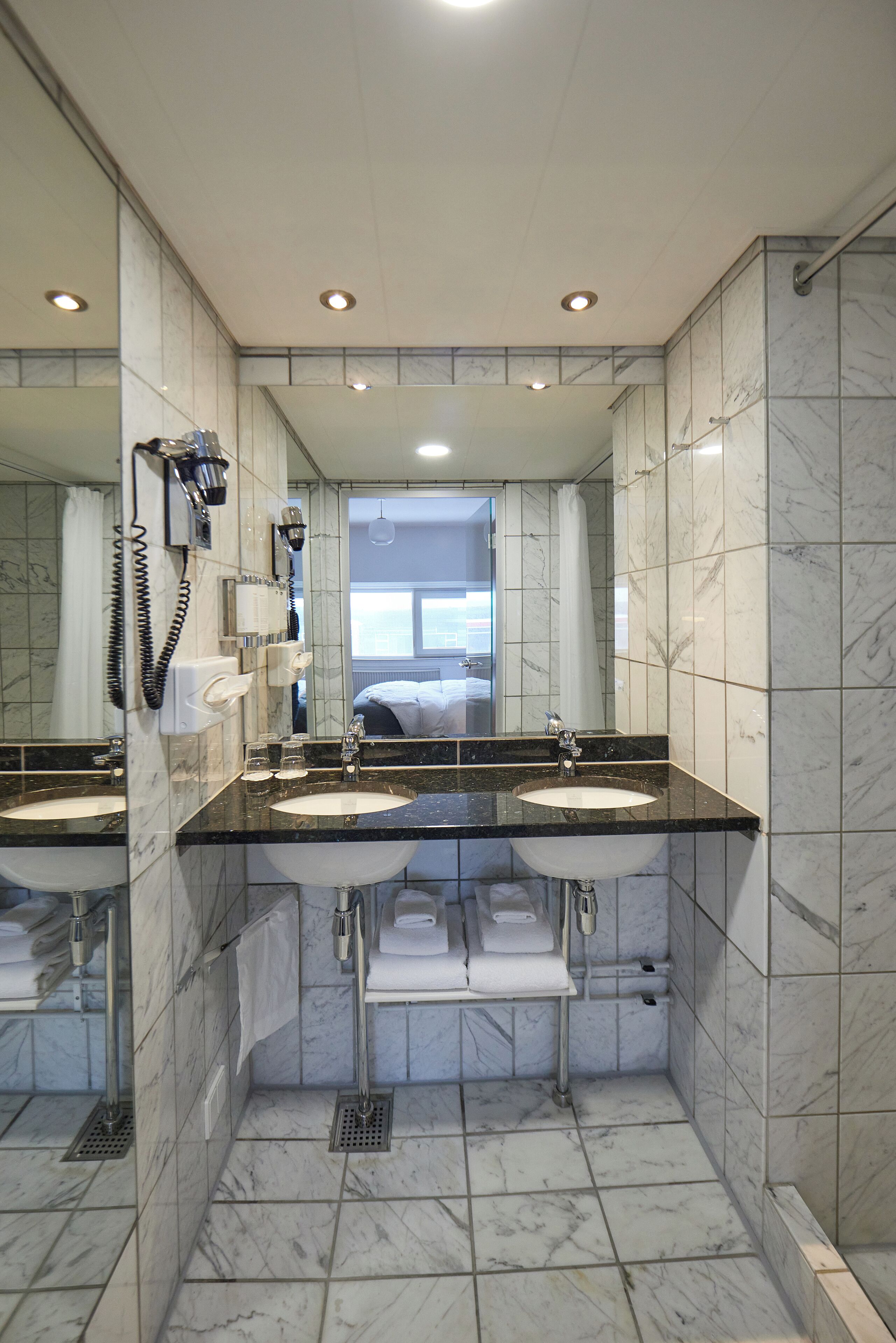 suite, bay view | bathroom | shower, free toiletries, hair dryer, towels