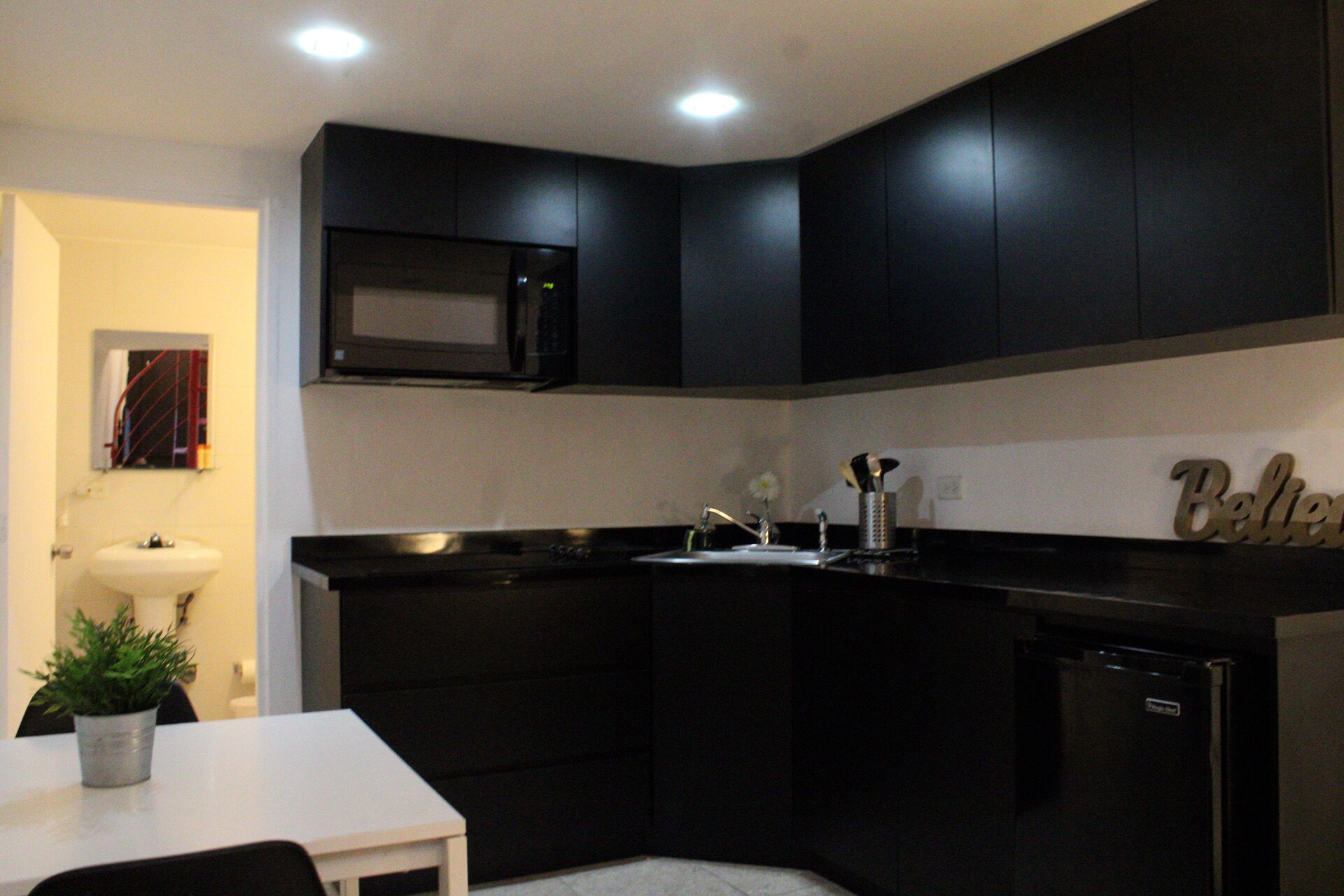 Fridge, microwave, stovetop, coffee/tea maker