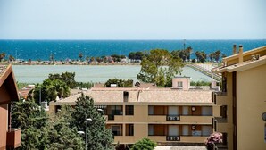 A coastal residential area with buildings overlooking the sea. - The terrace on the park - bathrooms in the room - panoramic - near the beach (Quartu Sant'Elena)