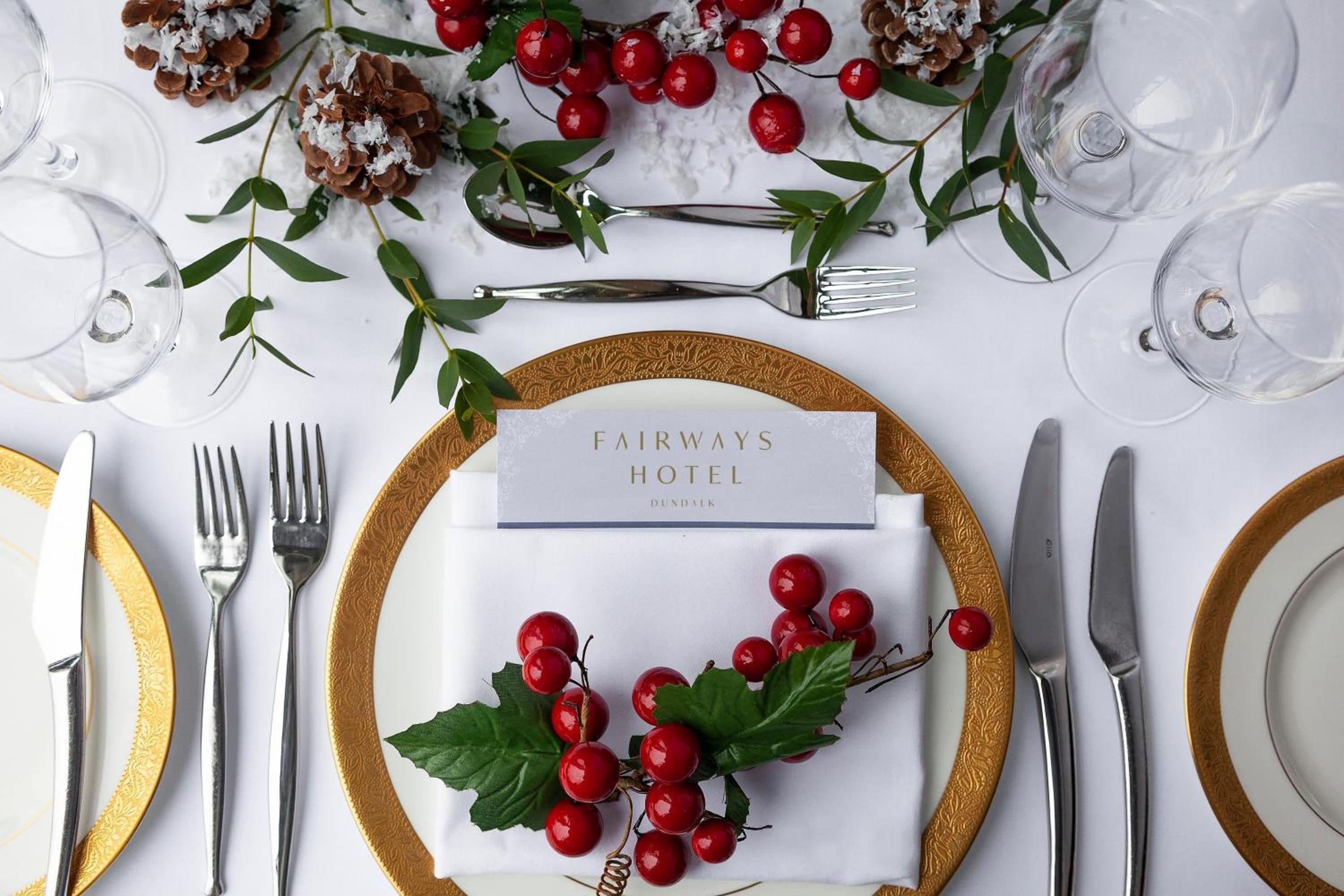 A table set for a meal with a placemat displaying 'FAIRWAYS HOTEL DUNDALK'.