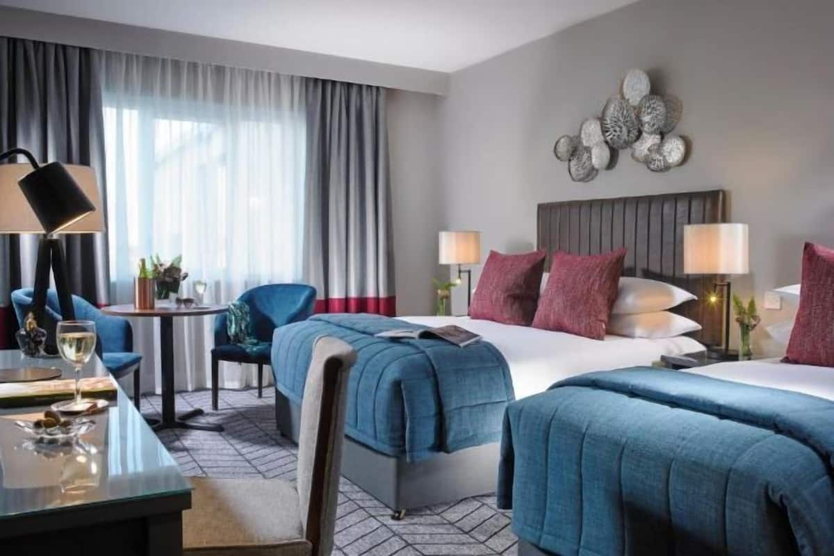 Memory-foam beds, in-room safe, desk, laptop workspace