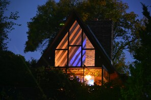 A house with a triangular roof and large windows. - ONE OF A KIND vacation rental with a view (Madison)