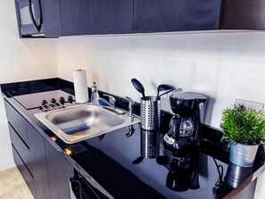 Fridge, microwave, stovetop, coffee/tea maker