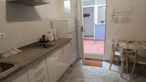 A modern kitchen with white cabinets, granite countertops, and a built-in oven. - Quiet in the historic center of Malaga (Málaga)