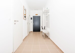 Entrance area and the view to the bedroom and WC + Bathroom