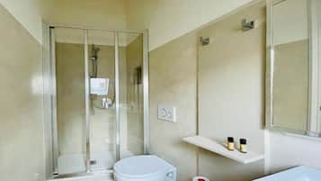 Hair dryer, towels, shampoo, toilet paper