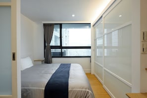 1 bedroom, desk, iron/ironing board, travel crib