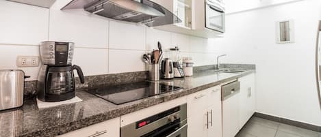 Microwave, dishwasher, coffee/tea maker, cookware/dishes/utensils