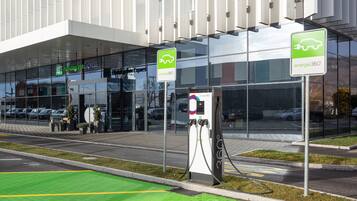 A Holiday Inn Express hotel with an electric vehicle charging station.