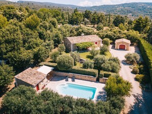 An aerial view of a property with a swimming pool, stone buildings, and a well-maintained garden. - Vacation rental house with pool LIOUX LS2-92 (Lioux)