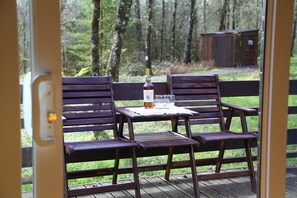 Outdoor dining - Berneray is a charming cabin in a beautiful setting, deep in the forest. (Taynuilt)