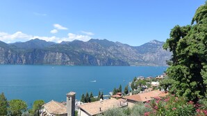 A coastal town with a clear view of the lake and mountains in the background.