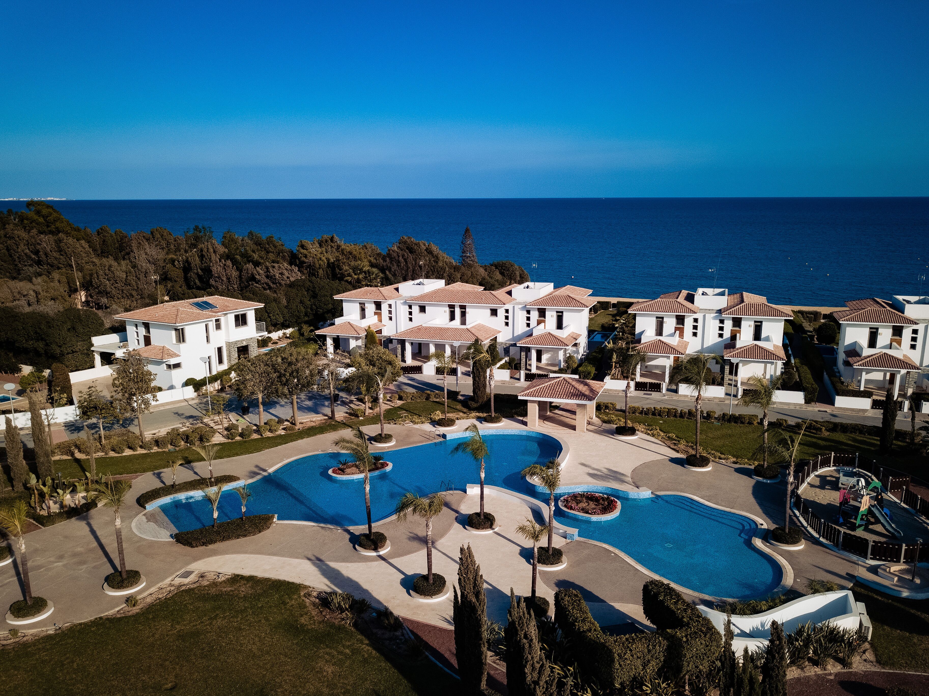 Seasonal outdoor pool, open 8:00 AM to 7:00 PM, pool umbrellas