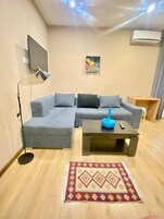 Family Apartment, 1 Bedroom, Balcony | Desk, laptop workspace, blackout drapes, soundproofing