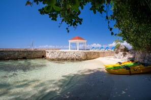 On the beach, sun-loungers, beach towels