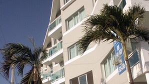 A multi-story building with a sign reading "Vista Marina."