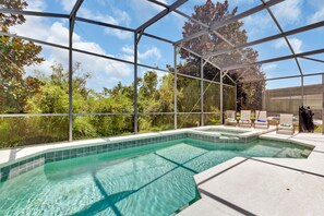 Outdoor pool, a heated pool - LUXE DISNEY HOME, POOL W/ SPA, GAME ROOM, FREE NETFLIX & WIFI (Davenport)