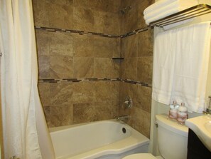 Combined shower/tub, hair dryer, towels, soap