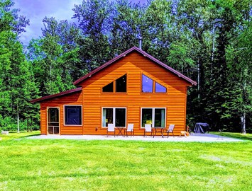 Front of the cabin, largely kept yard.