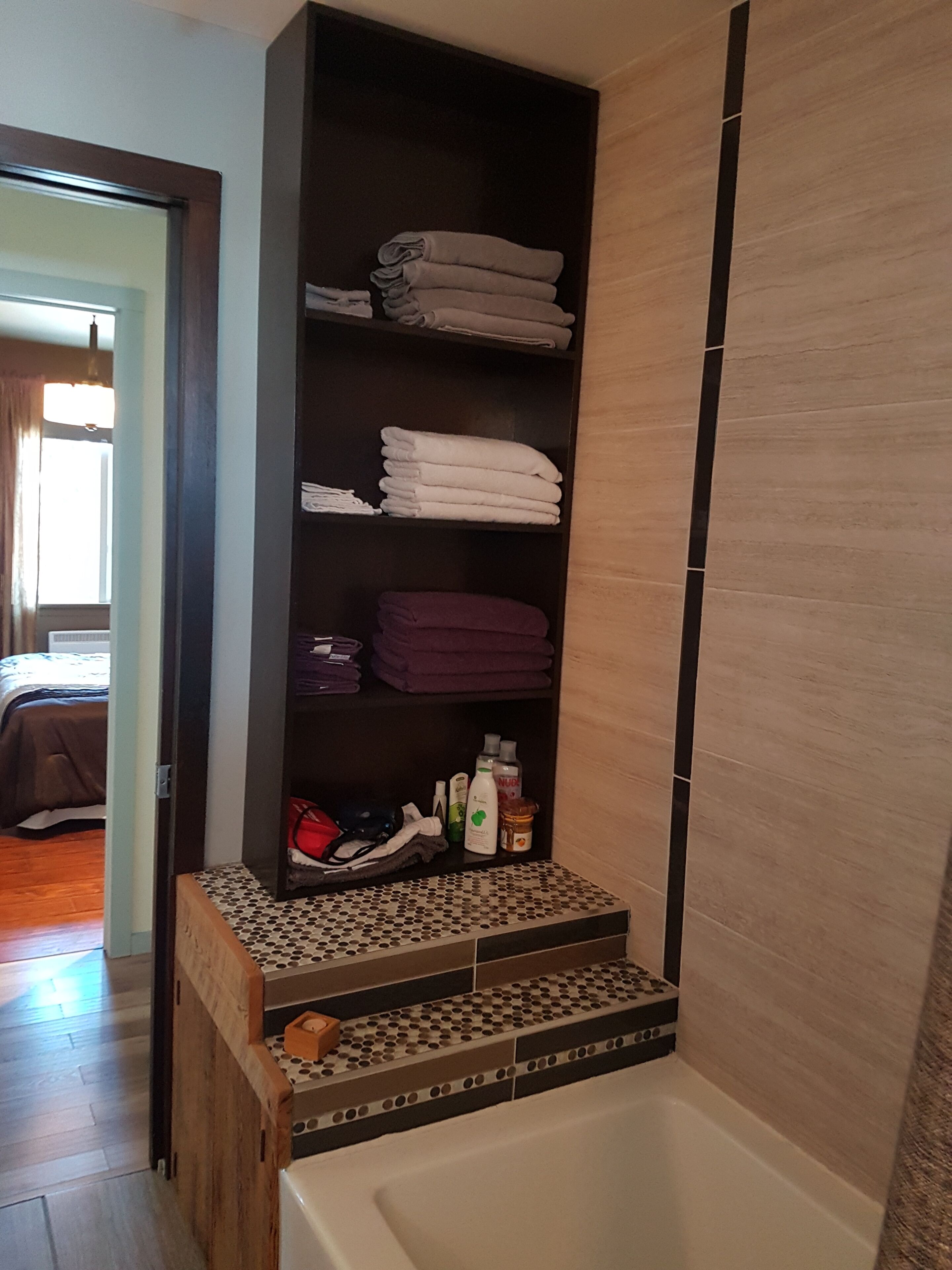 Combined shower/bathtub, hair dryer, towels, soap