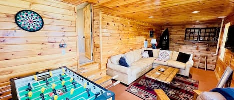 Flat-screen TV, fireplace, foosball