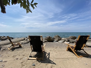 On the beach, sun loungers, beach towels