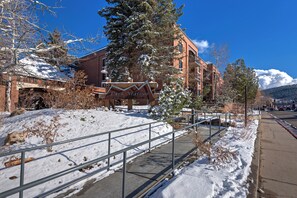 A snow-covered landscape with a building labeled 'Park Station' and a metal bridge.
