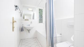 Combined shower/tub, hair dryer, towels, soap