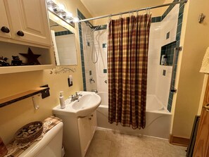 Combined shower/tub, hair dryer, towels, soap