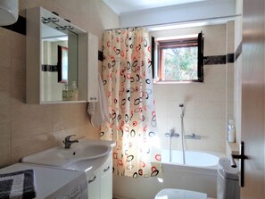 Bathtub, hair dryer, towels