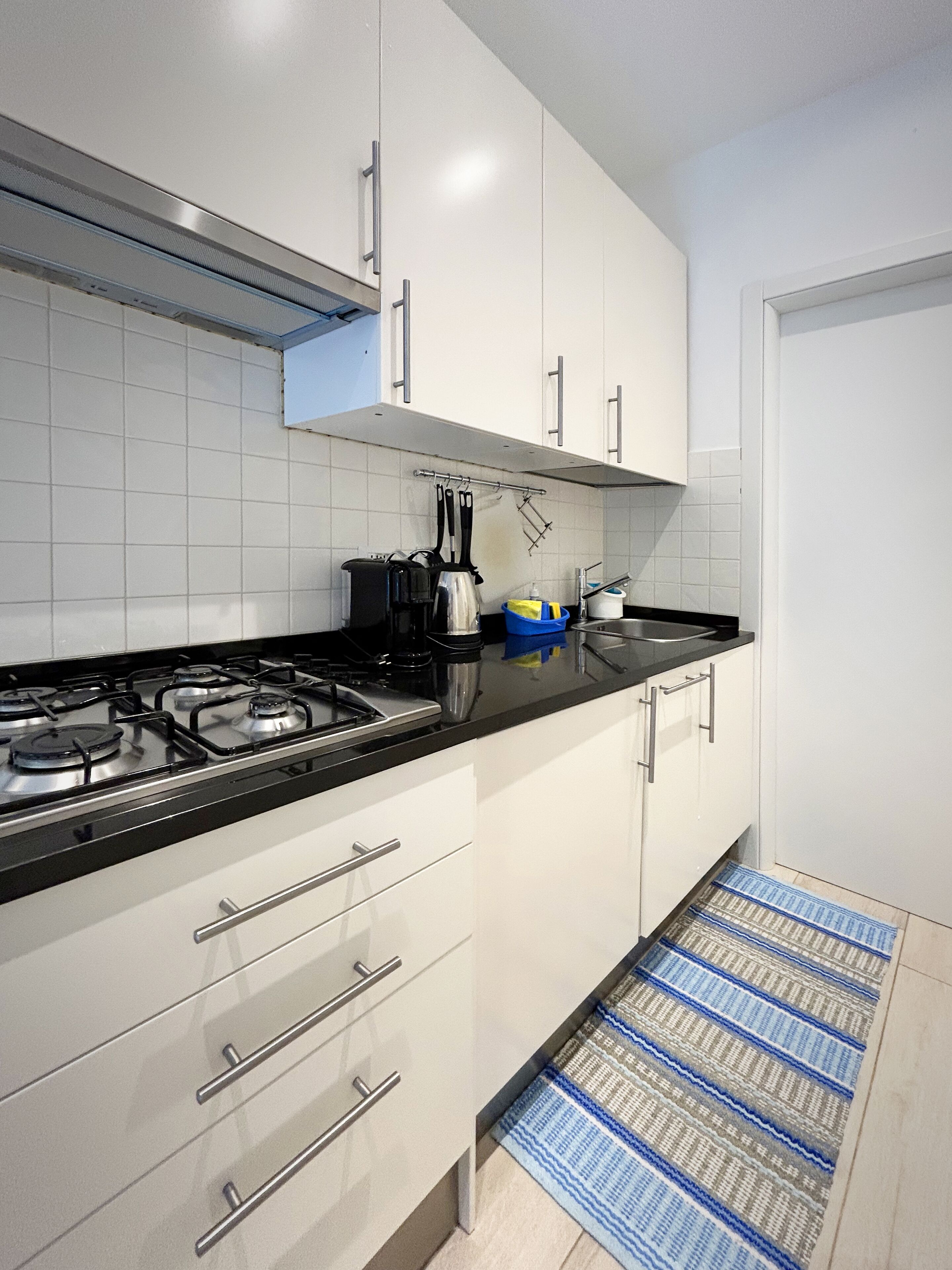 Fridge, coffee/tea maker, cookware/dishes/utensils, spices