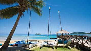 On the beach, sun loungers, beach towels