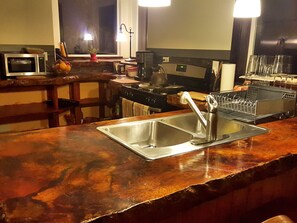 Our kitchen and bar, big enough to provide entertainment for 8.