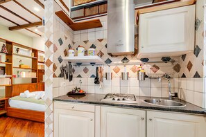 Fridge, microwave, stovetop, coffee/tea maker