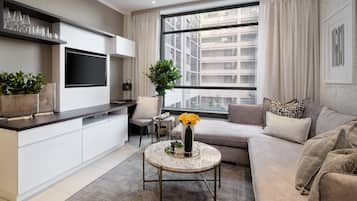Luxury Apartment | Living area | 42-inch Smart TV with satellite channels, TV