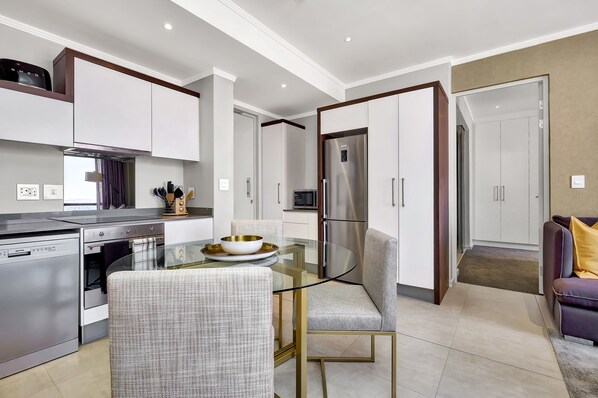 Masingita Towers (2) | Living area | 42-inch Smart TV with satellite channels, TV - Masingita Towers (Sandton)