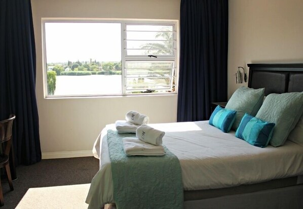 In-room safe, desk, laptop workspace, blackout curtains