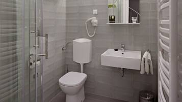 Regadera, secadora de cabello, toallas, jabón