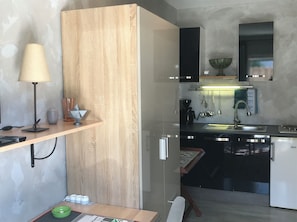 Fridge, microwave, stovetop, coffee/tea maker