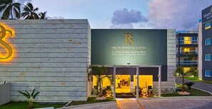 Experience the Presidential Suites at A Lifestyle Holidays Vacation Resort, featuring a grand entrance with a covered walkway and beautifully landscaped surroundings.